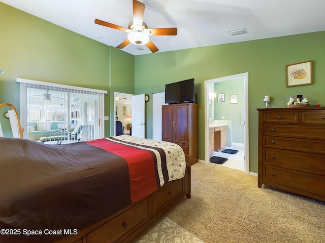 bedroom featuring ensuite bathroom, lofted ceiling, light colored carpet, access to exterior, and ceiling fan