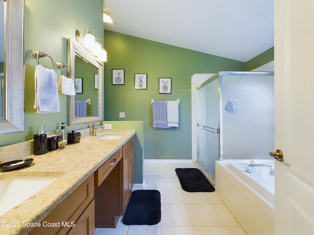 bathroom featuring lofted ceiling, vanity, tile patterned floors, and independent shower and bath