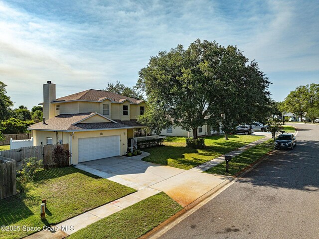 828 Parkwood Ave, Titusville, FL 32796 - view of front facade featuring concrete driveway, an attached garage, a chimney, roof with shingles, and stucco siding