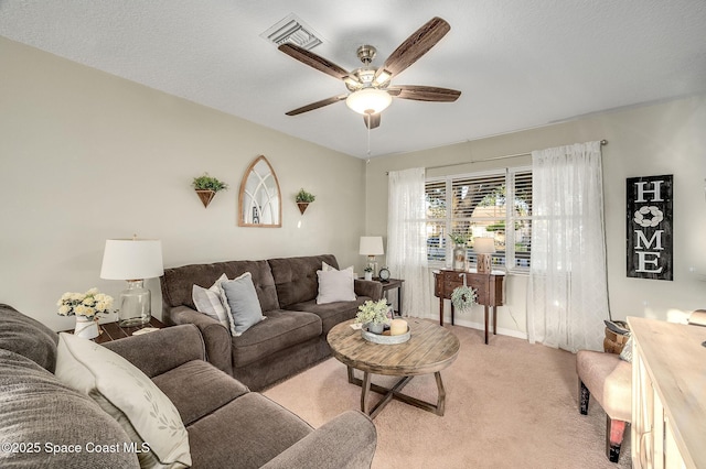 828 Parkwood Ave, Titusville, FL 32796 - living area featuring ceiling fan, light colored carpet, and baseboards