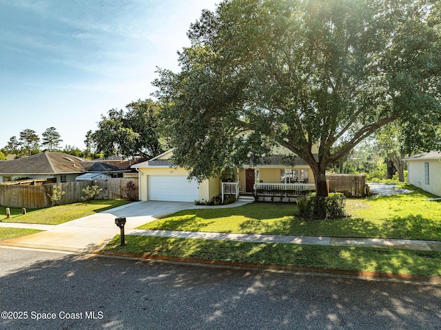828 Parkwood Ave, Titusville, FL 32796 - obstructed view of property featuring driveway, a garage, and covered porch