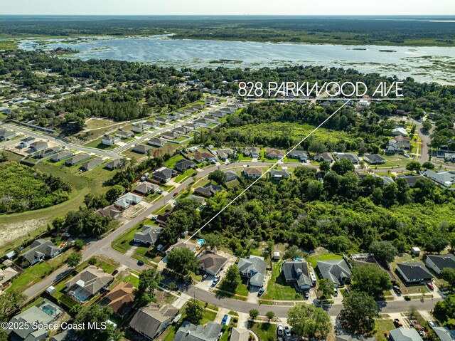 828 Parkwood Ave, Titusville, FL 32796 - aerial view of residential area featuring a large body of water and property boundaries highlighted