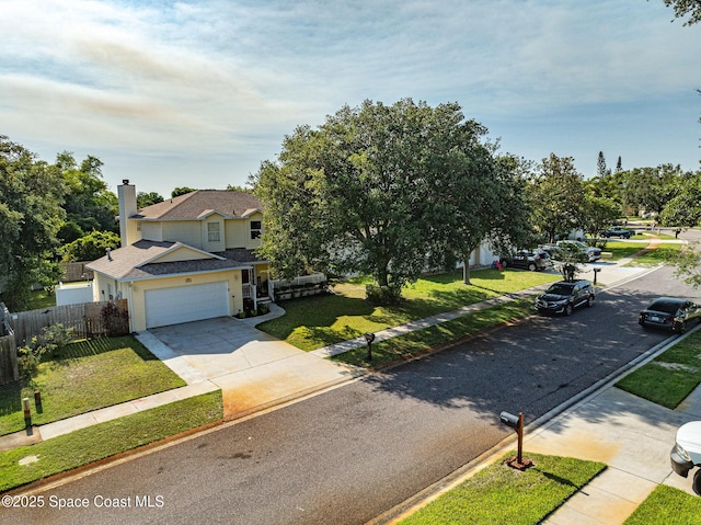 828 Parkwood Ave, Titusville, FL 32796 - view of front of home featuring concrete driveway, a garage, roof with shingles, and a chimney