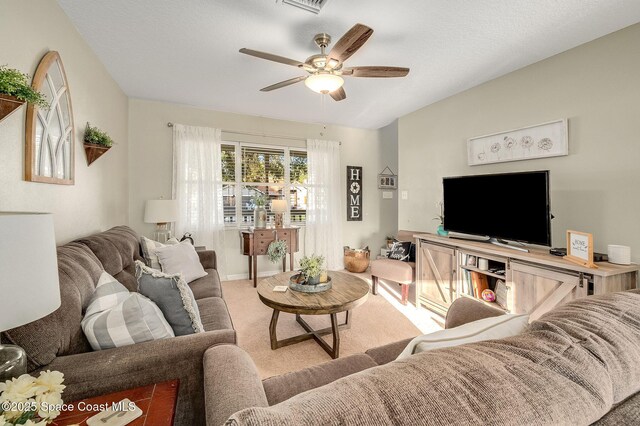 828 Parkwood Ave, Titusville, FL 32796 - carpeted living area featuring ceiling fan and baseboards