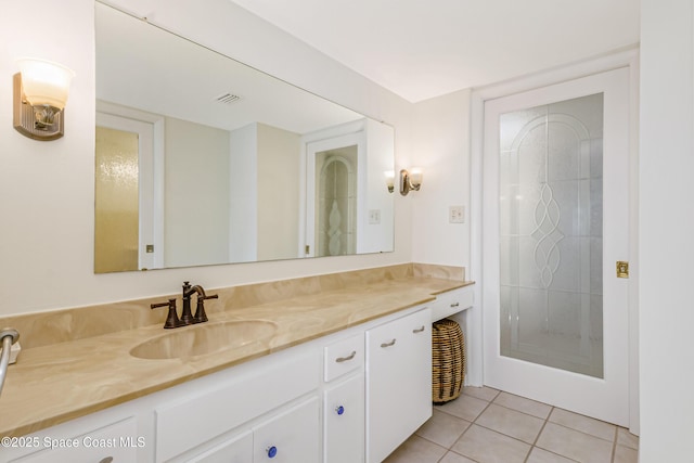 bathroom with vanity and tile patterned floors