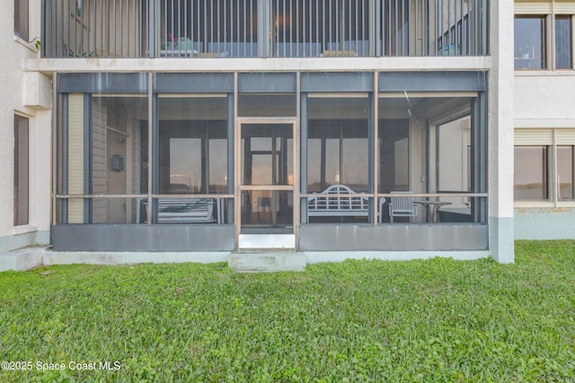 rear view of house with a lawn