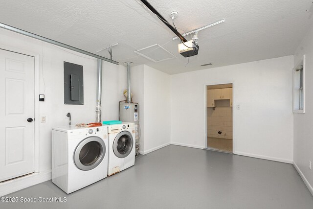 laundry room with gas water heater, washing machine and clothes dryer, a textured ceiling, and electric panel