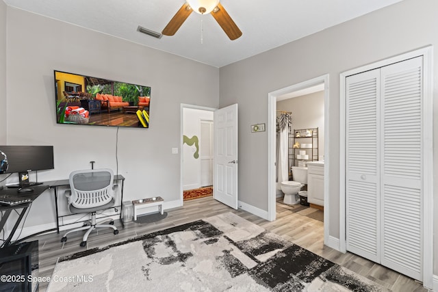 office area with ceiling fan and wood-type flooring