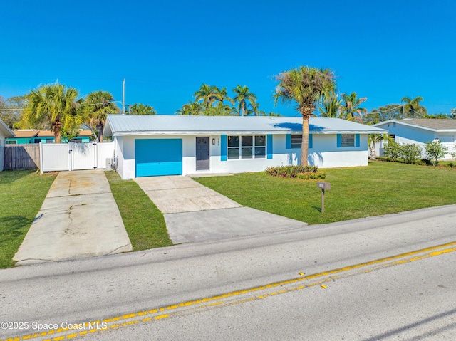 single story home with a garage and a front yard