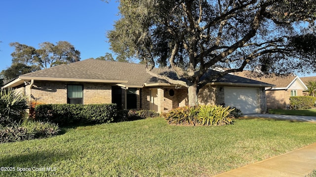 single story home featuring a garage and a front lawn