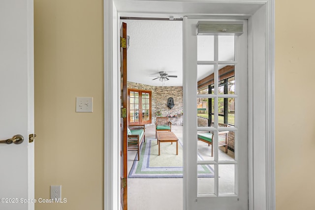 entryway featuring french doors and ceiling fan