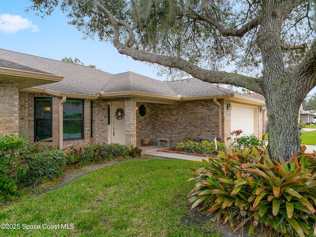 ranch-style house with a garage and a front yard