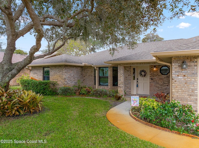 ranch-style home with a front yard