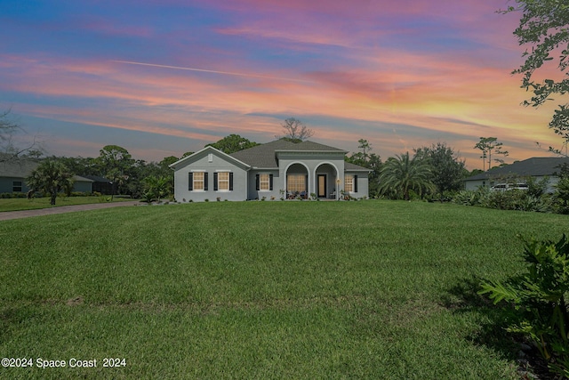 view of front of home with a yard