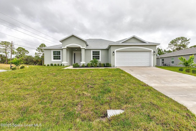 view of front facade with a garage and a front lawn