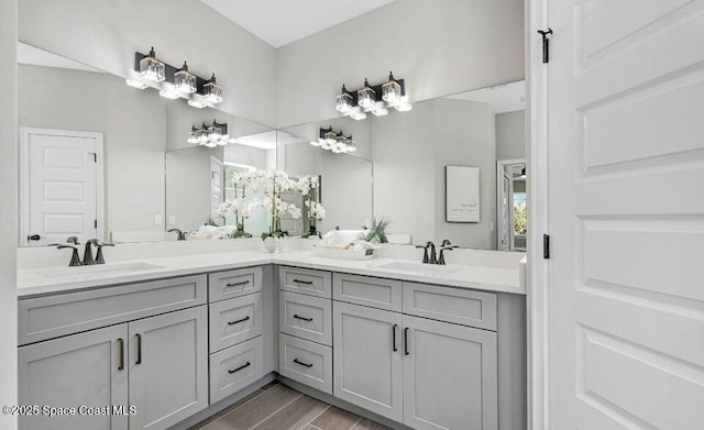 full bath with double vanity and a sink