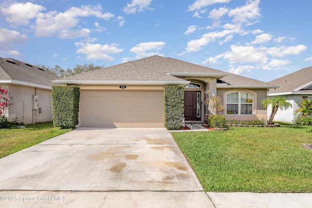 ranch-style house with a garage, concrete driveway, a front yard, and stucco siding