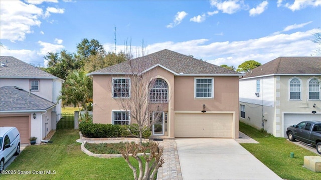 view of front property with a garage and a front yard