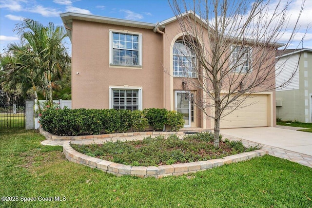 view of front of property with a garage and a front lawn