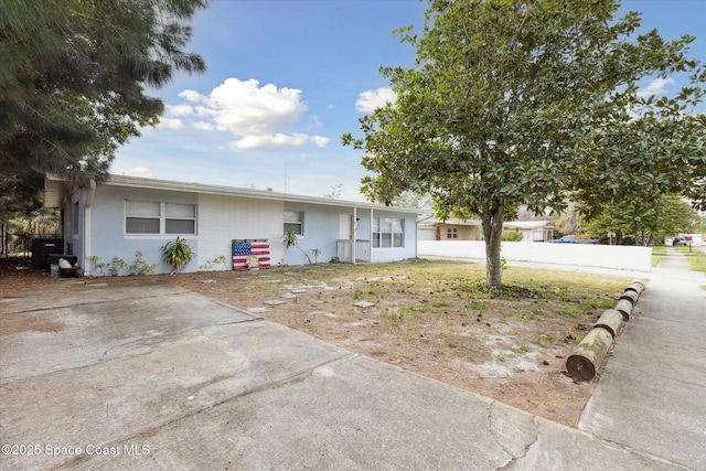225 Court St, Titusville, FL 32780 - ranch-style house with central AC unit and stucco siding