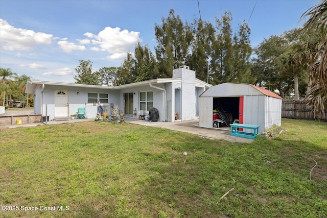 225 Court St, Titusville, FL 32780 - rear view of property with a chimney and stucco siding