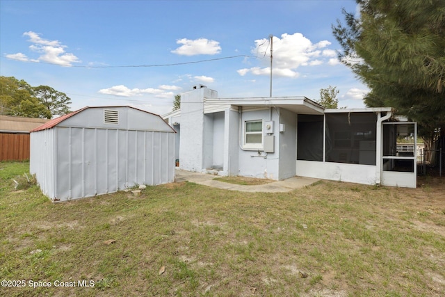 225 Court St, Titusville, FL 32780 - rear view of property featuring a sunroom and a yard
