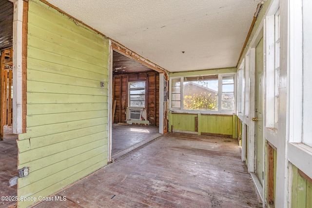 unfurnished sunroom with cooling unit