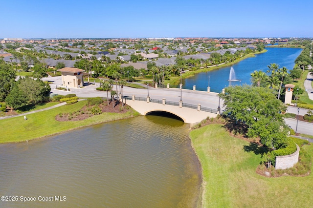 birds eye view of property with a residential view and a water view