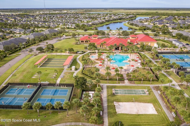 drone / aerial view with a water view and a residential view