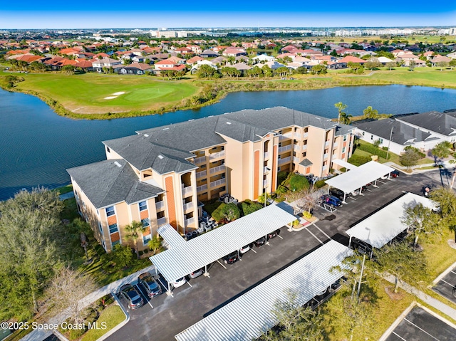 bird's eye view with a residential view and a water view