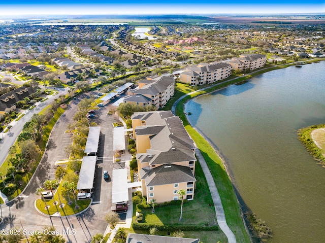 aerial view with a water view and a residential view