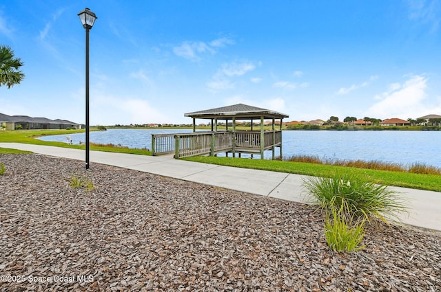 view of dock featuring a water view and a gazebo