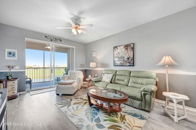 living room featuring light wood-style floors and ceiling fan