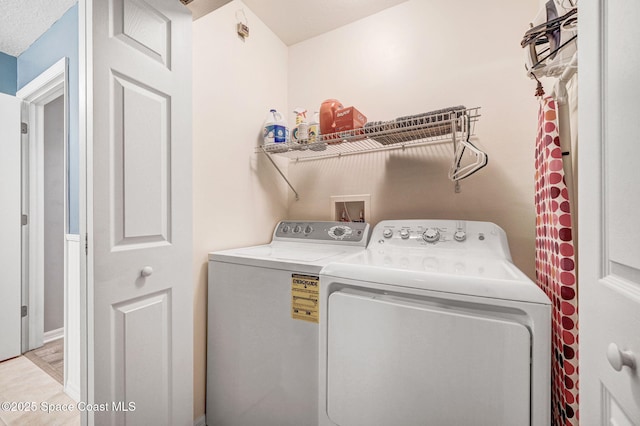 laundry area featuring laundry area and washing machine and dryer