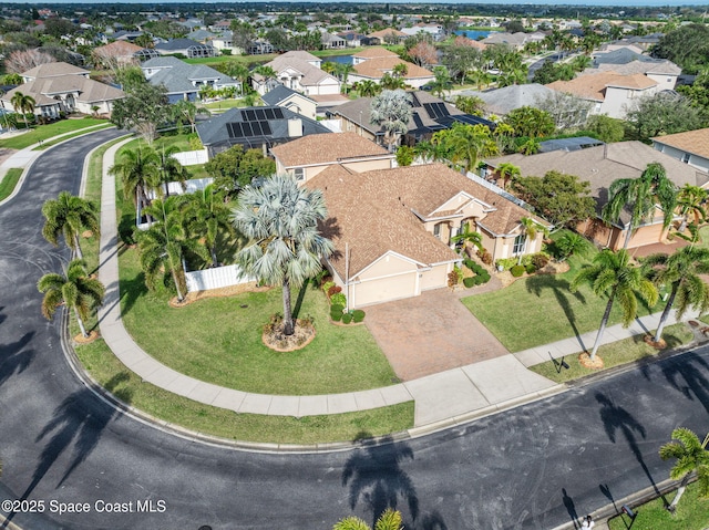 birds eye view of property with a residential view