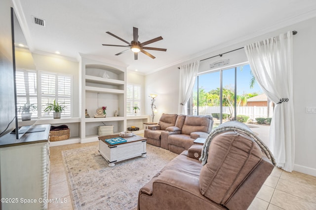 living room with built in features, visible vents, crown molding, and light tile patterned floors