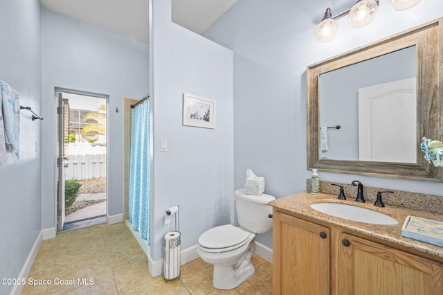 bathroom with baseboards, toilet, curtained shower, tile patterned flooring, and vanity