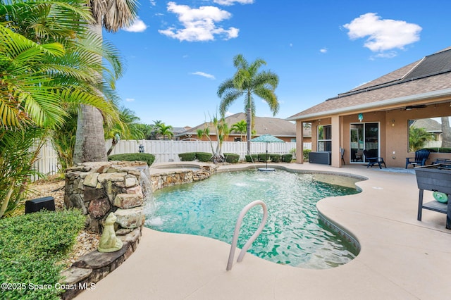 view of pool with a fenced backyard, a fenced in pool, a patio, and an in ground hot tub