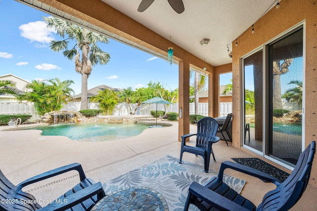 view of pool featuring ceiling fan, a patio area, a fenced backyard, and a fenced in pool