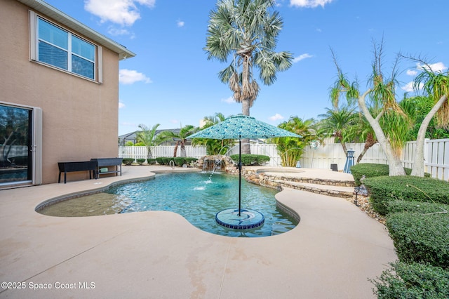 view of pool featuring a patio area, a fenced backyard, and a fenced in pool