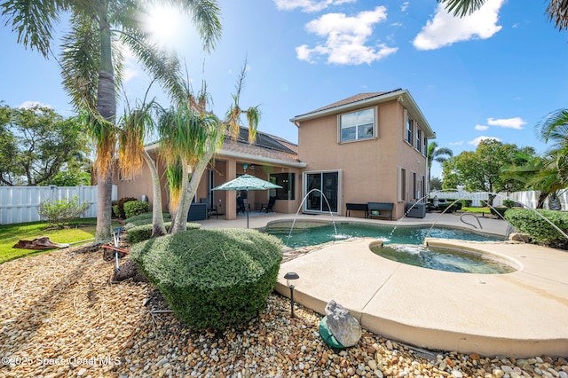 view of swimming pool with a patio, fence, an outdoor hot tub, and a fenced in pool