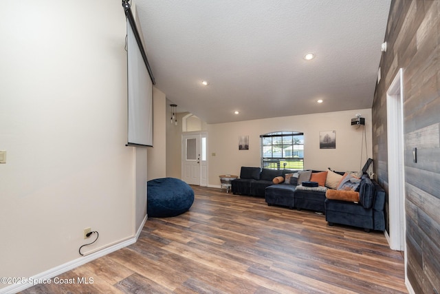 living room with hardwood / wood-style floors and a textured ceiling