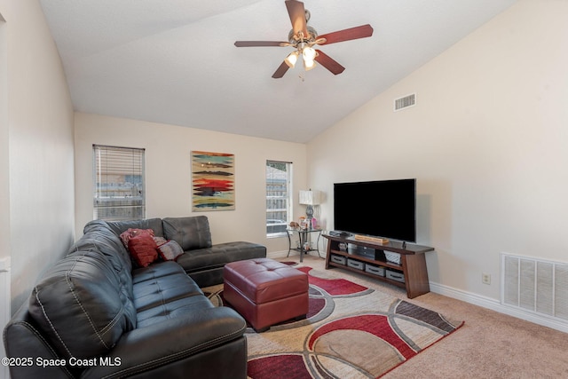 living room with ceiling fan, light colored carpet, and lofted ceiling