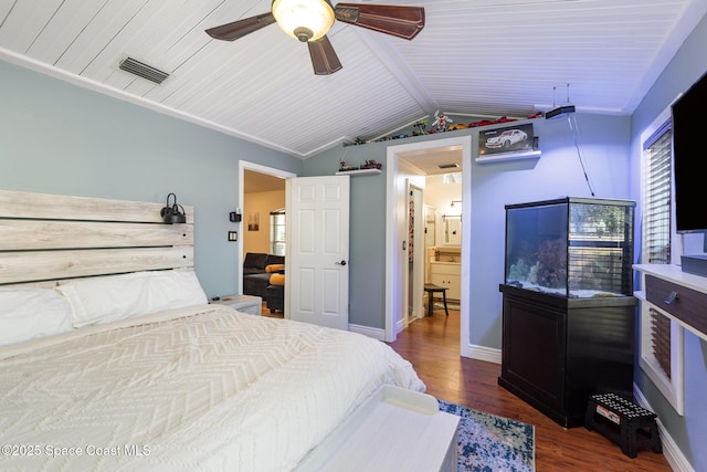 bedroom with lofted ceiling, dark hardwood / wood-style floors, and ceiling fan