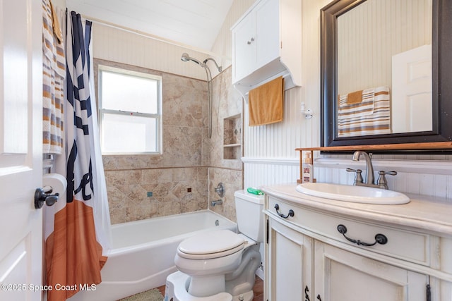 full bathroom featuring shower / tub combo with curtain, vanity, and toilet