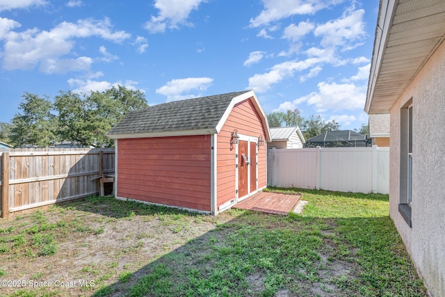 view of outdoor structure featuring a lawn