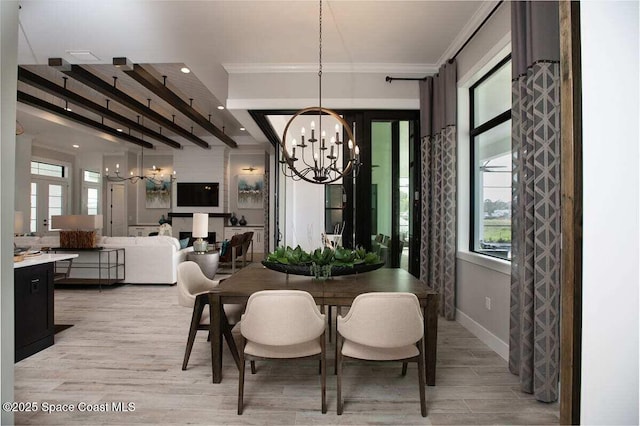 dining area featuring ornamental molding, beam ceiling, a chandelier, and light hardwood / wood-style floors