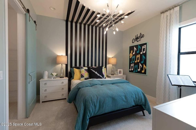 bedroom featuring a barn door, light carpet, and a chandelier