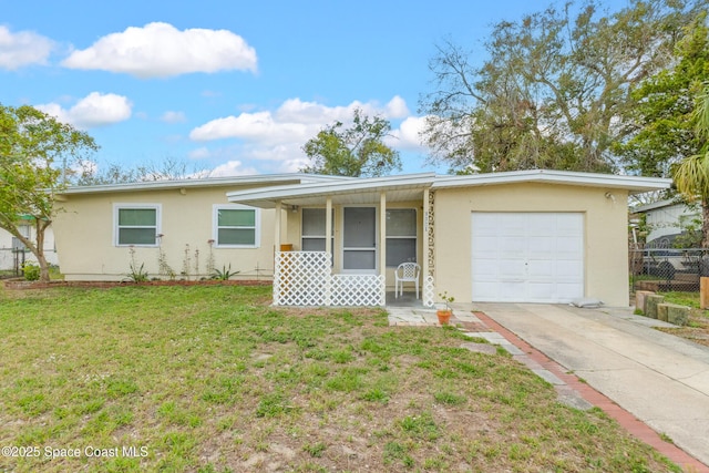 single story home featuring a garage and a front lawn