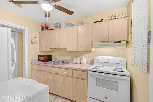 kitchen with ceiling fan, sink, light brown cabinetry, and white appliances